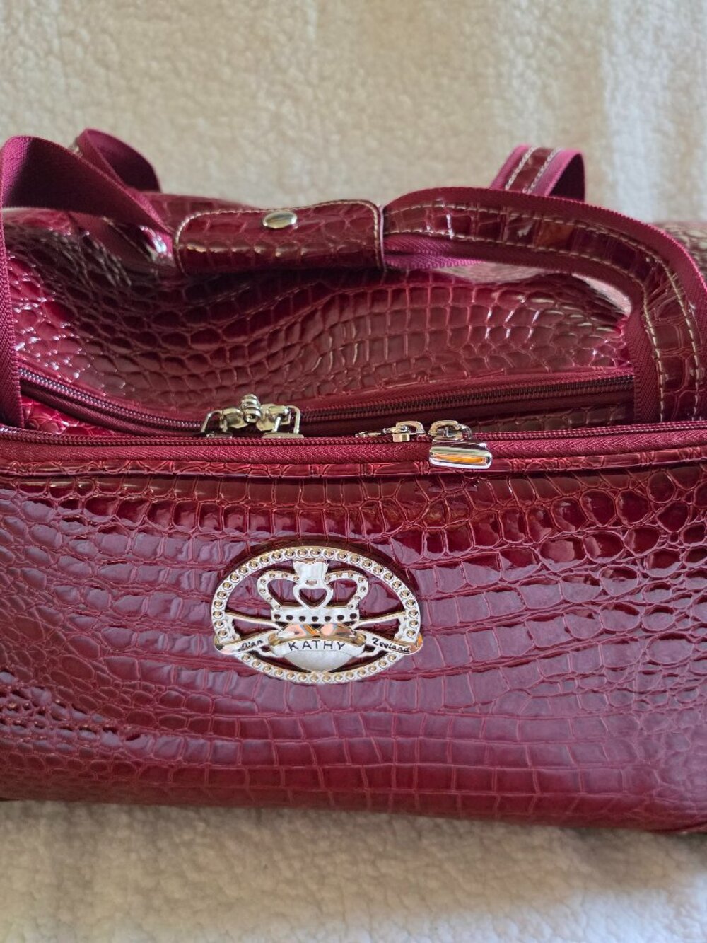 KATHY VAN ZEELAND Maroon Croco ROLLING DUFFLE BAG LUGGAGE